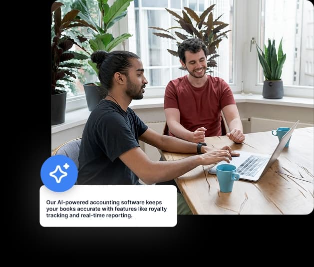 Two people at laptop